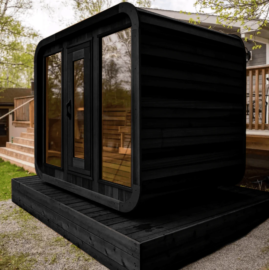 A sleek black modern outdoor pod with glass doors and windows.