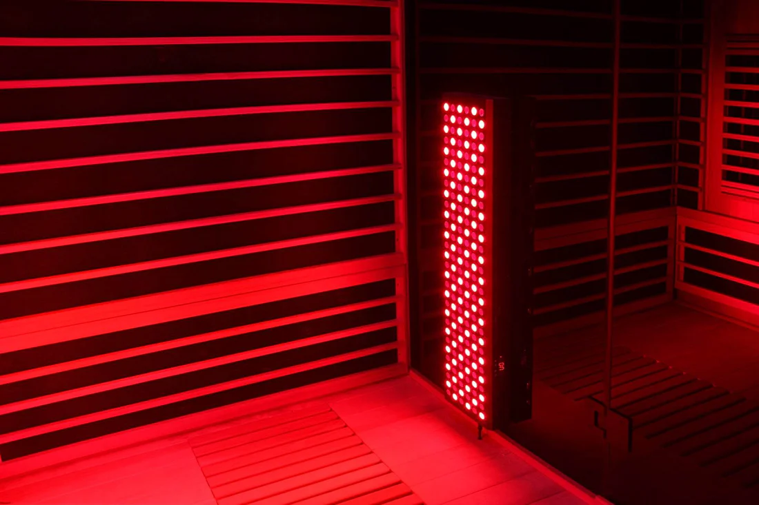 Red light illuminating a room with patterned shadows.