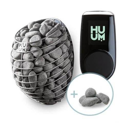 A set of charcoal briquettes with a digital device showing "HUM".