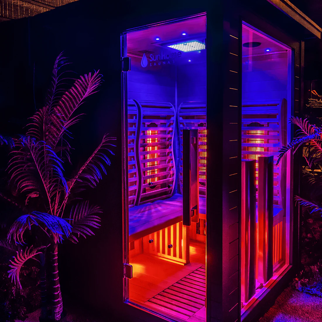 A futuristic phone booth illuminated with vibrant purple and red lights.