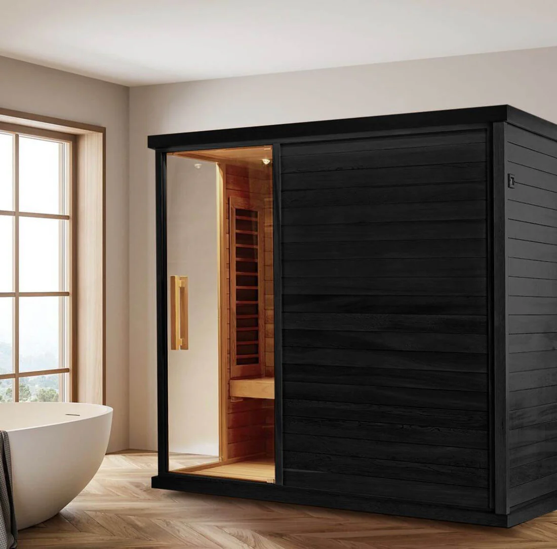 Modern black sauna cabin in a bright bathroom.