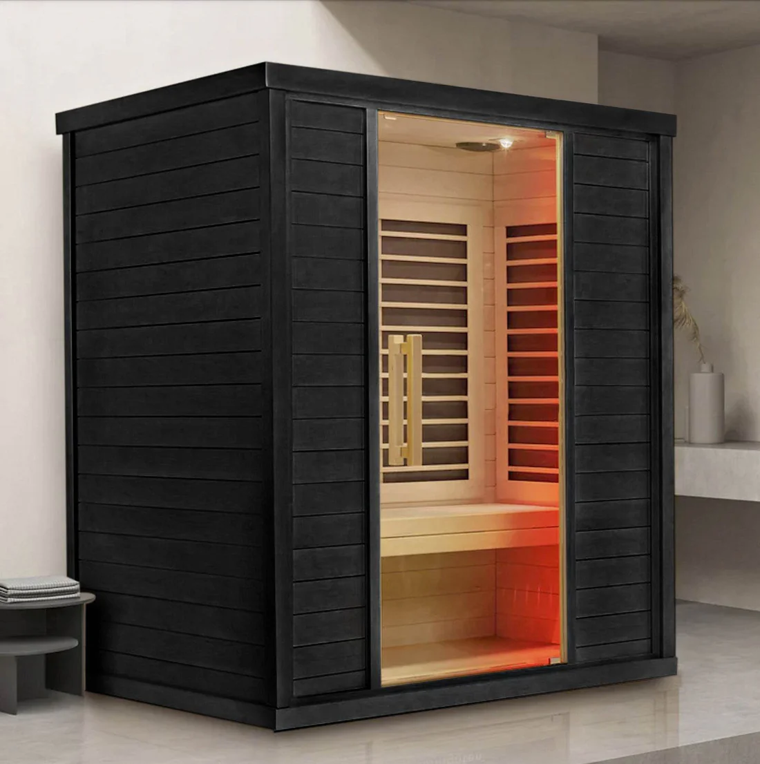 Contemporary black infrared sauna with amber lighting