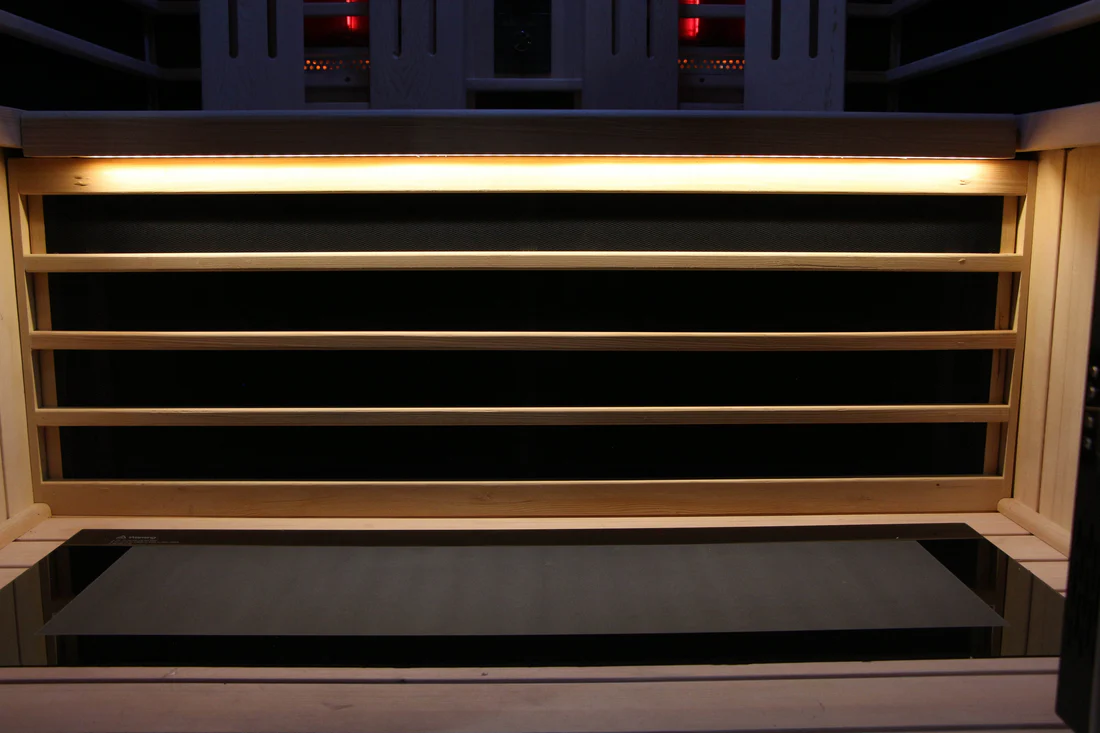 Close-up of a black and yellow striped object with a glowing horizontal light.