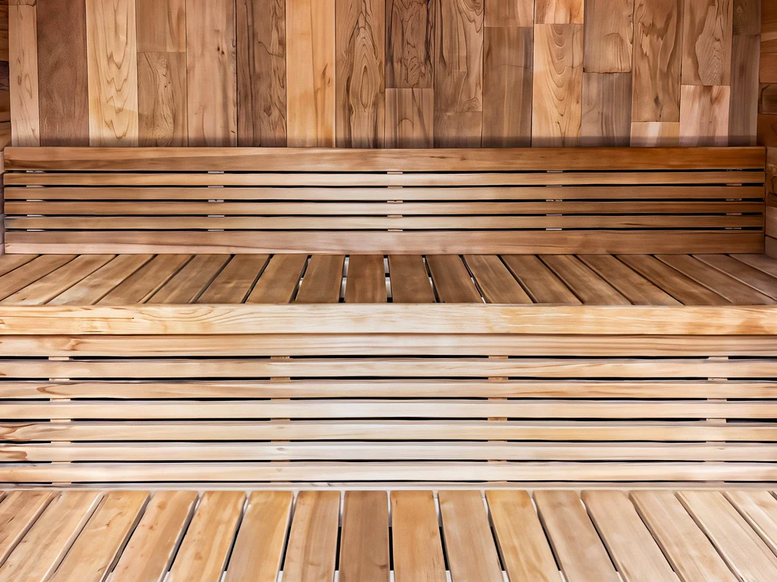 Interior of a wooden sauna with bench seating.