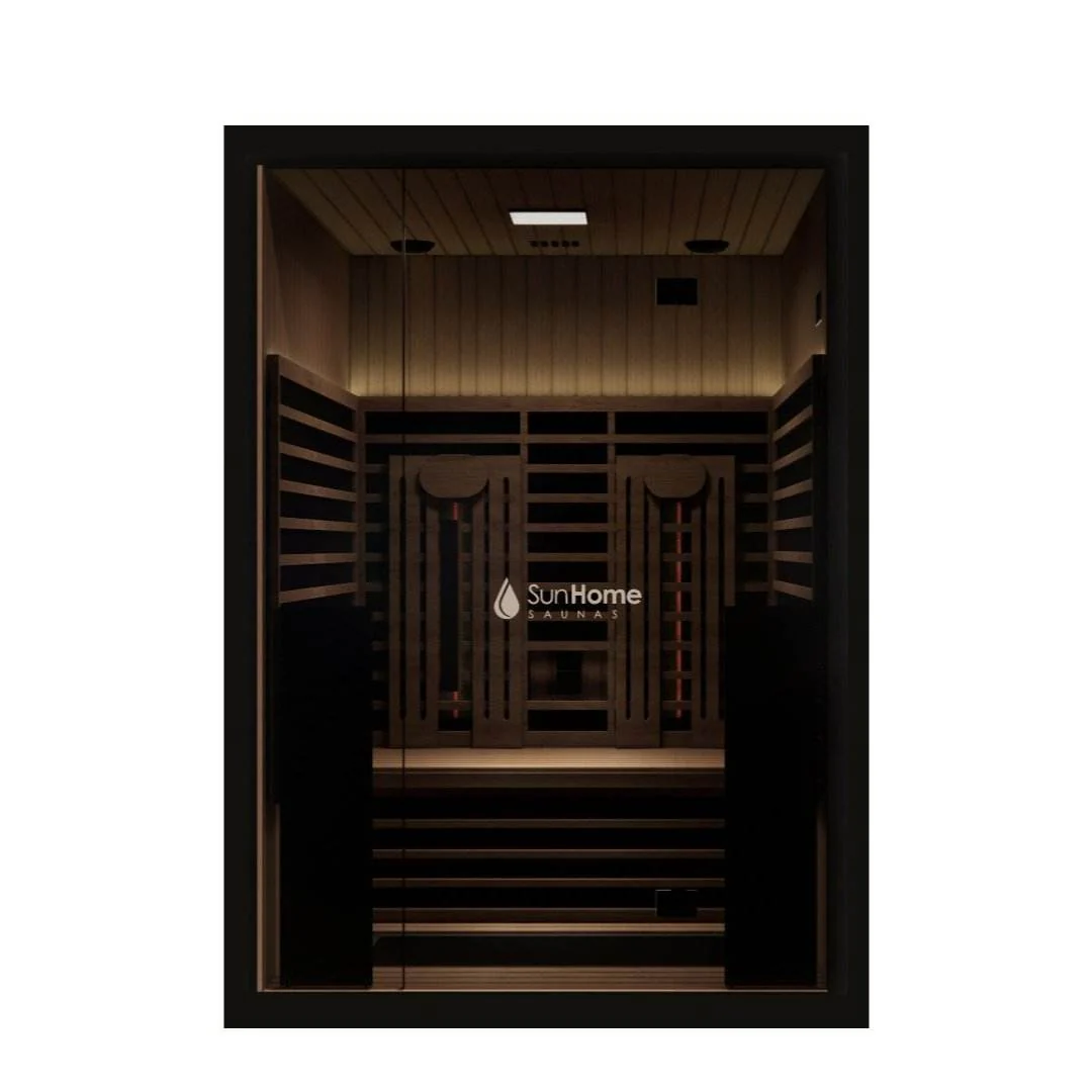A modern infrared sauna with wooden benches and dark glass door.