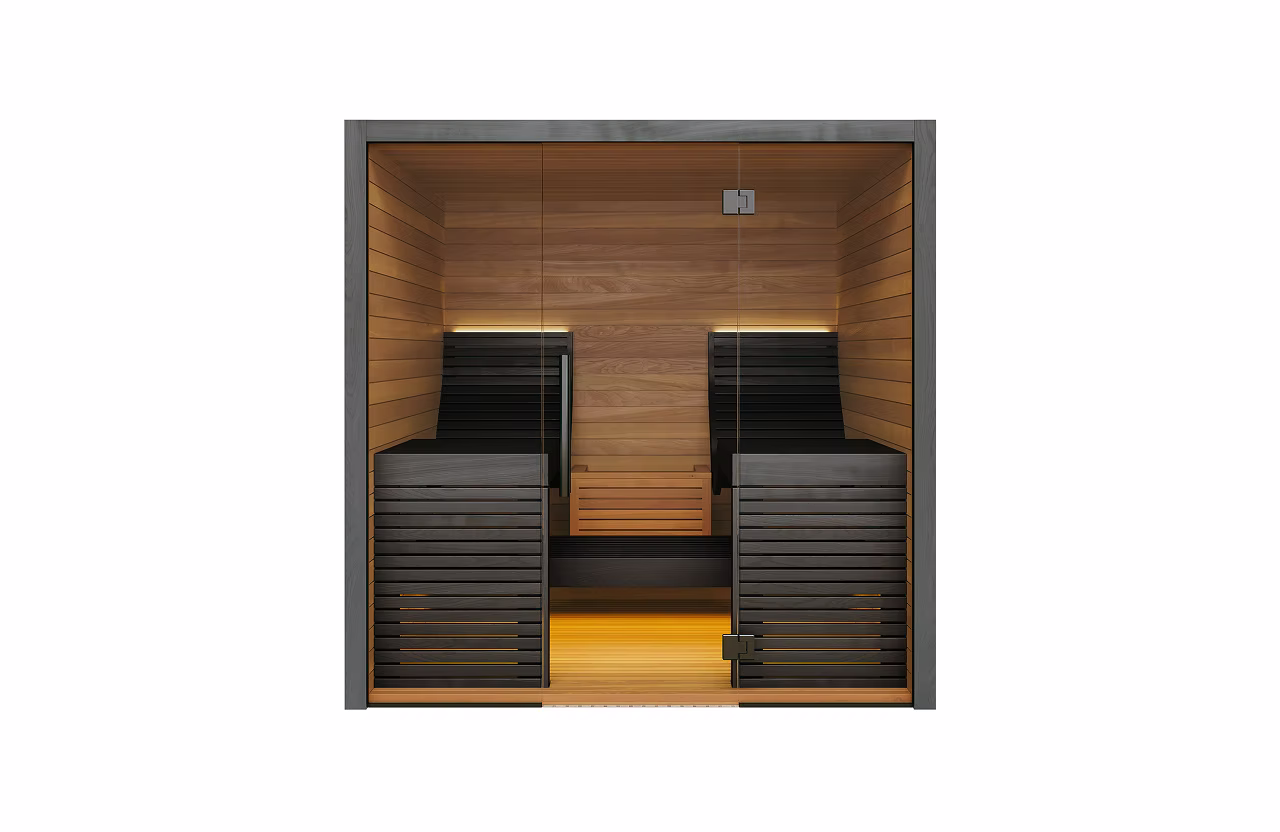 Modern wooden sauna room with two black lounge chairs and warm lighting.