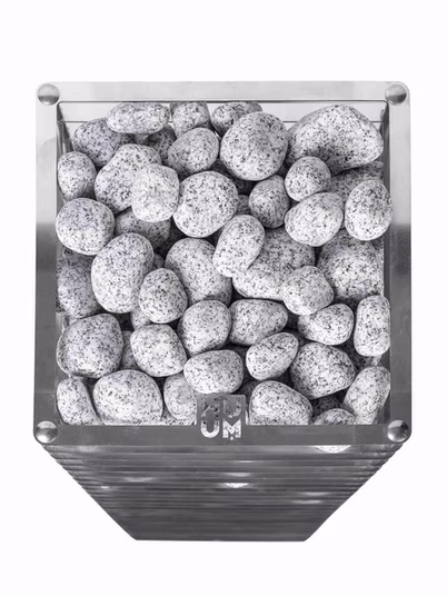 Close-up of a black container filled with gray speckled stones.