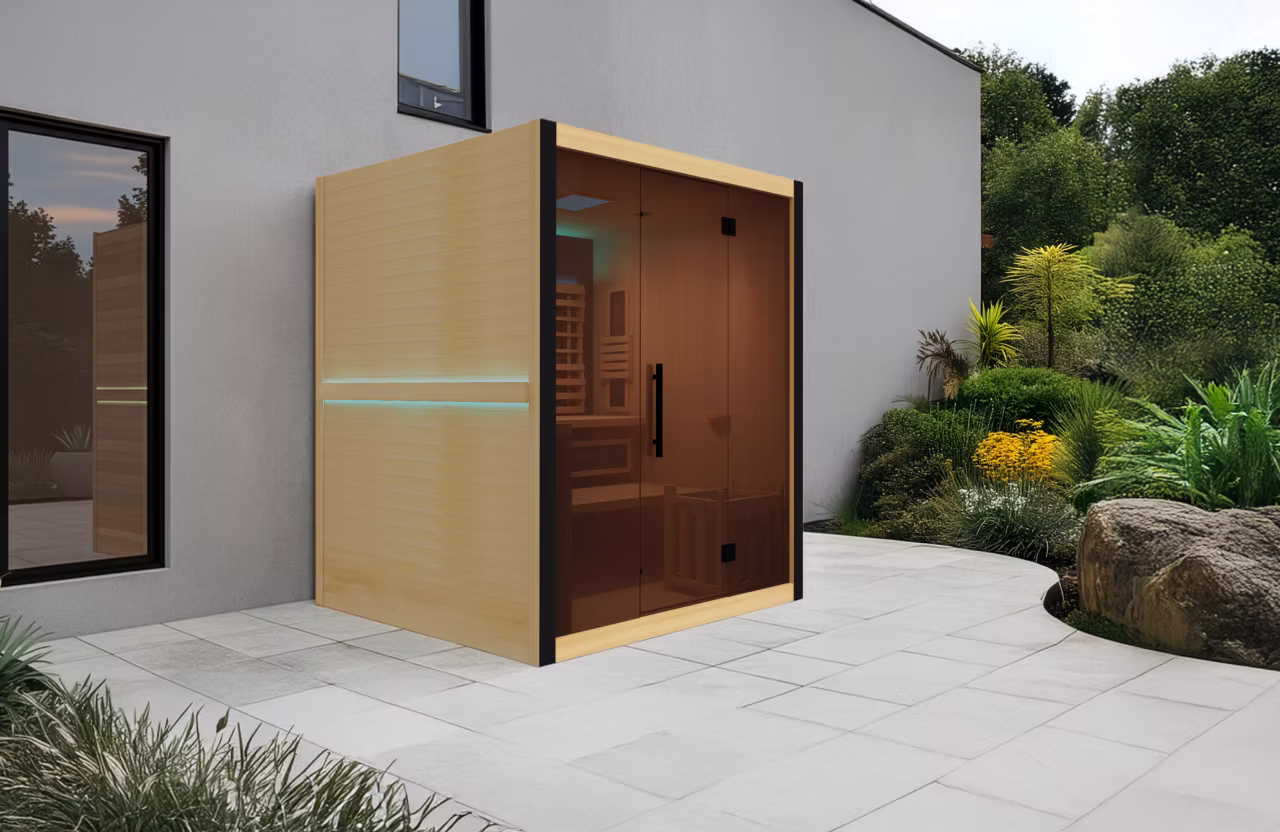 Modern sauna with wooden exterior and glass door in a backyard.