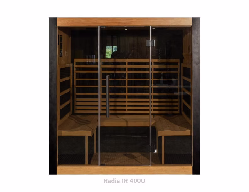 Modern wooden sauna with glass door and benches inside.