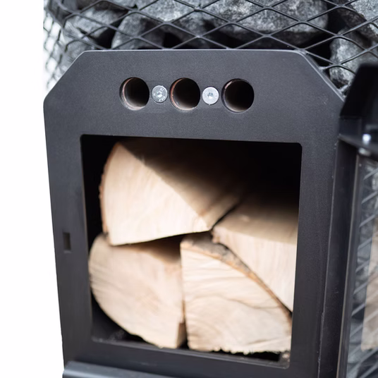 A small black wood stove filled with stacked firewood.