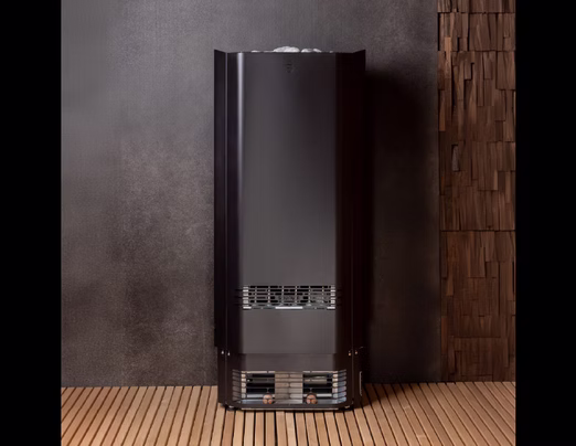 Tall, sleek black speaker with modern design on wooden floor.