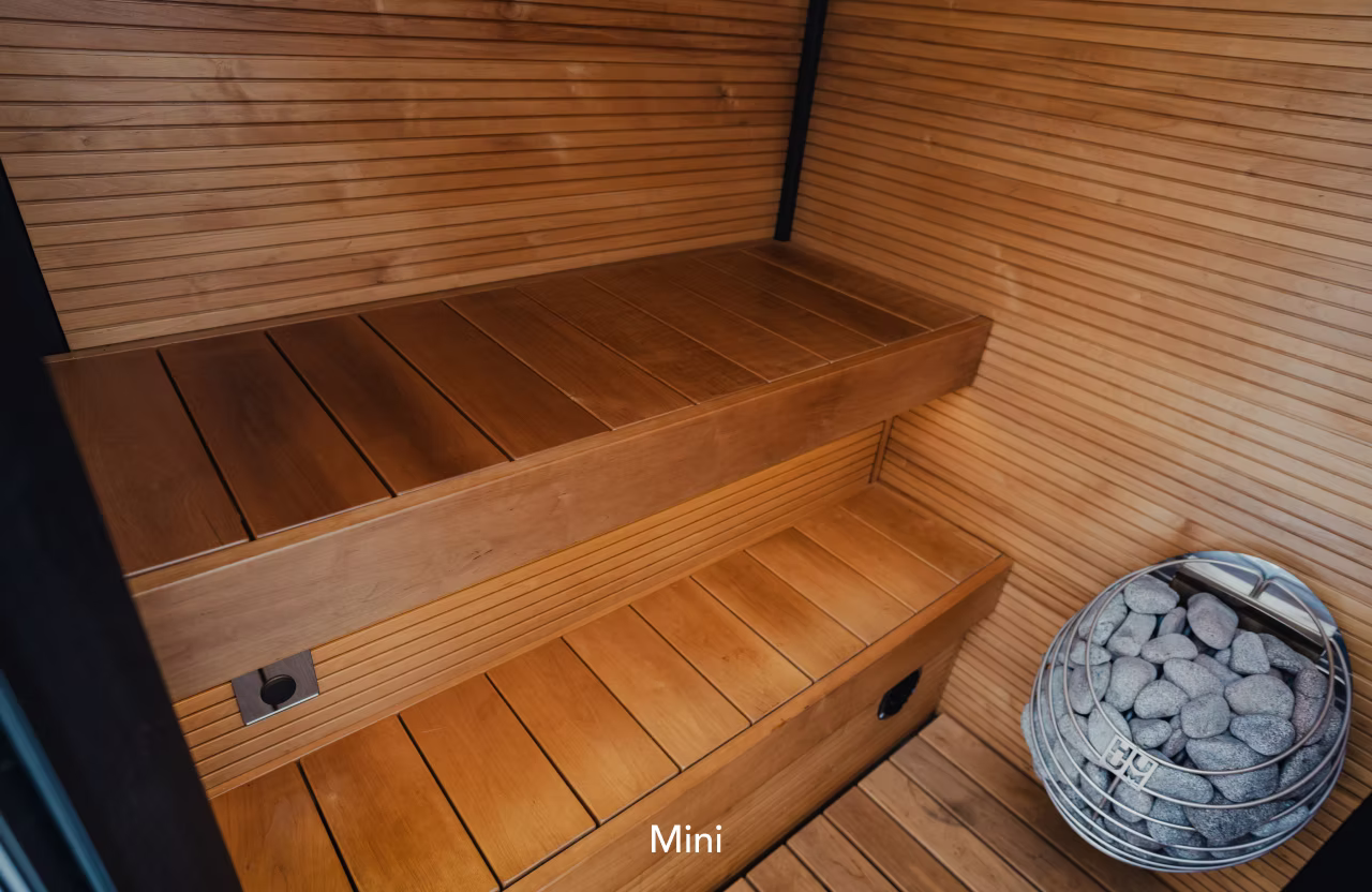 Compact wooden sauna bench with storage drawer beneath.