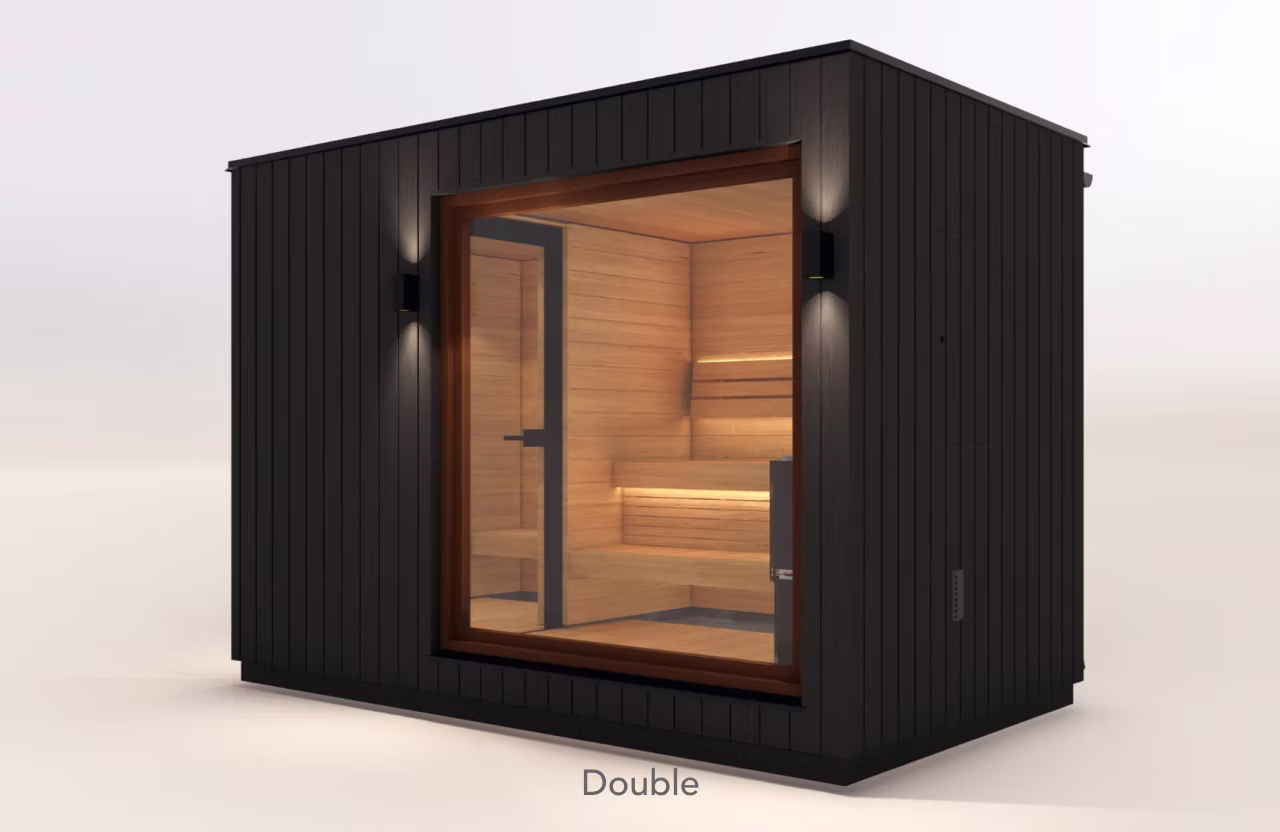 Modern black sauna with wooden interior and glass door.