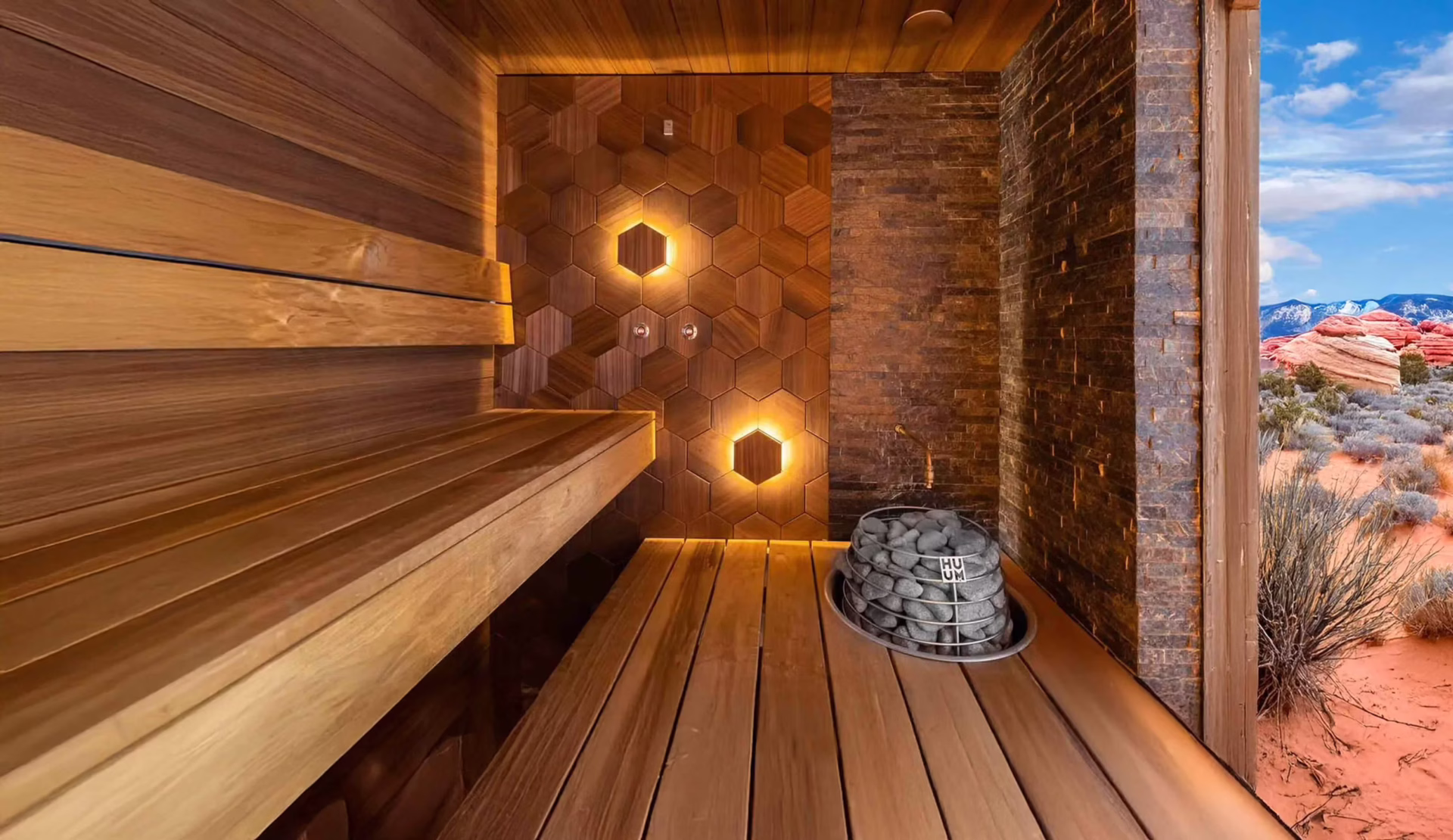 Cozy wooden sauna with warm lighting and heated stones.