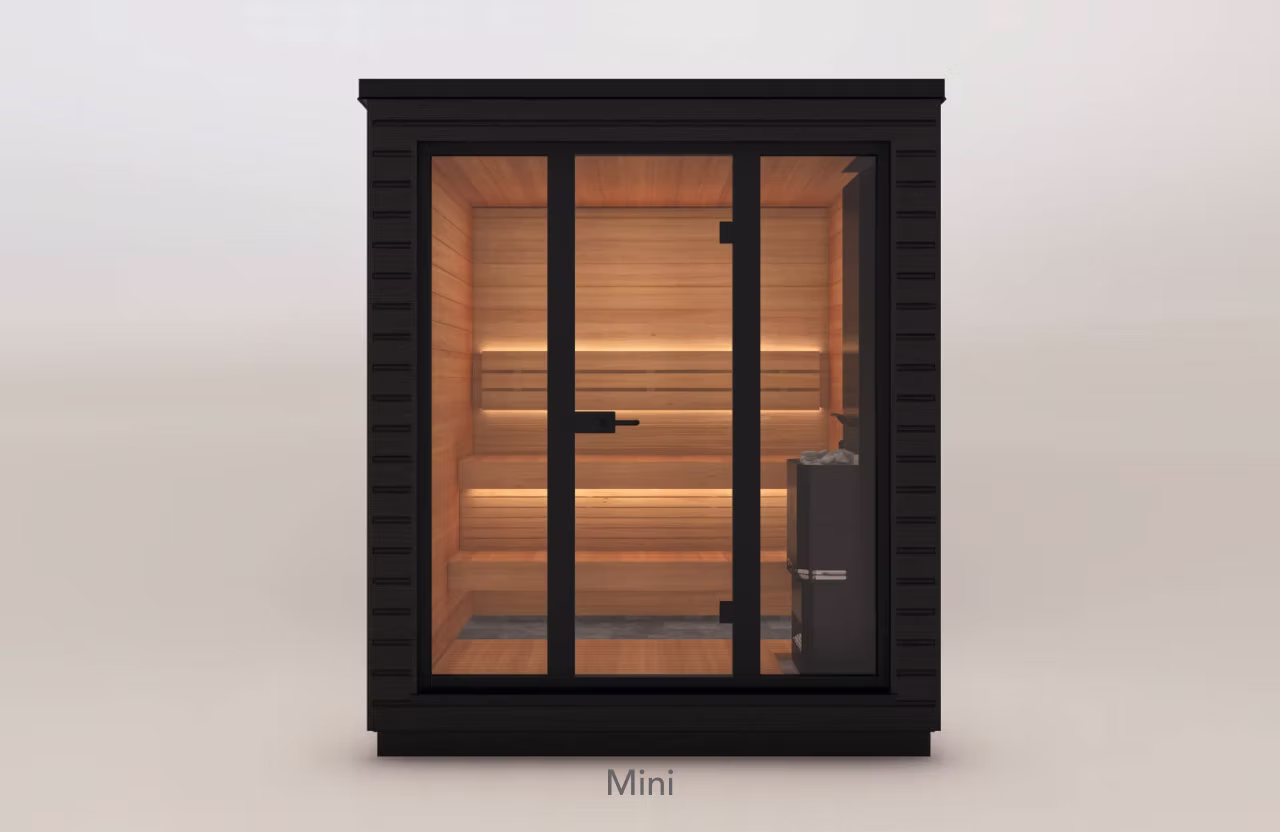 Modern small sauna with glass front and black exterior.
