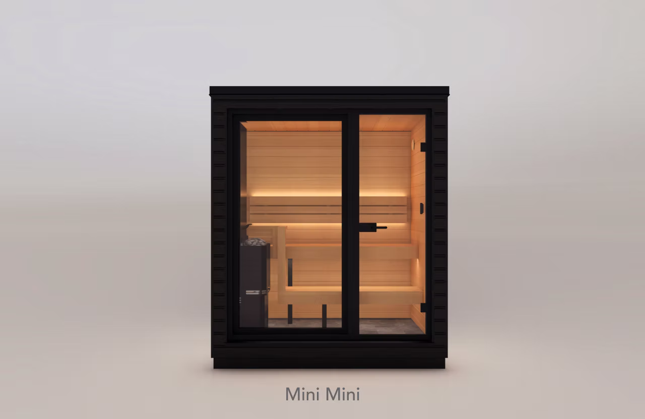 Compact modern sauna with glass door and warm interior lighting.