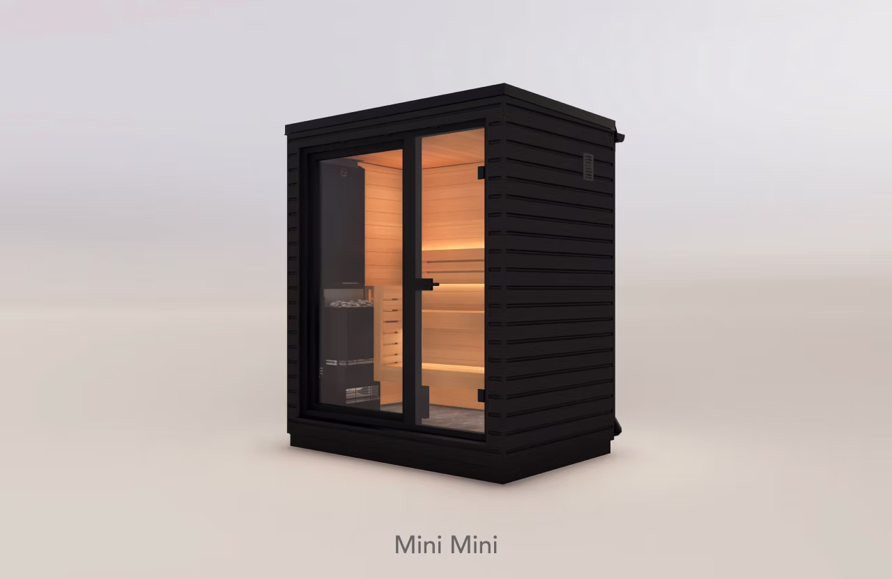 Compact modern black sauna with glass door and warm interior lighting.
