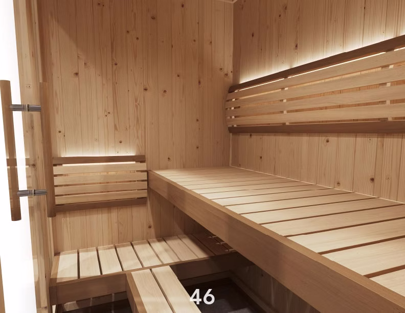 Cozy wooden sauna interior with bench seating and soft lighting.