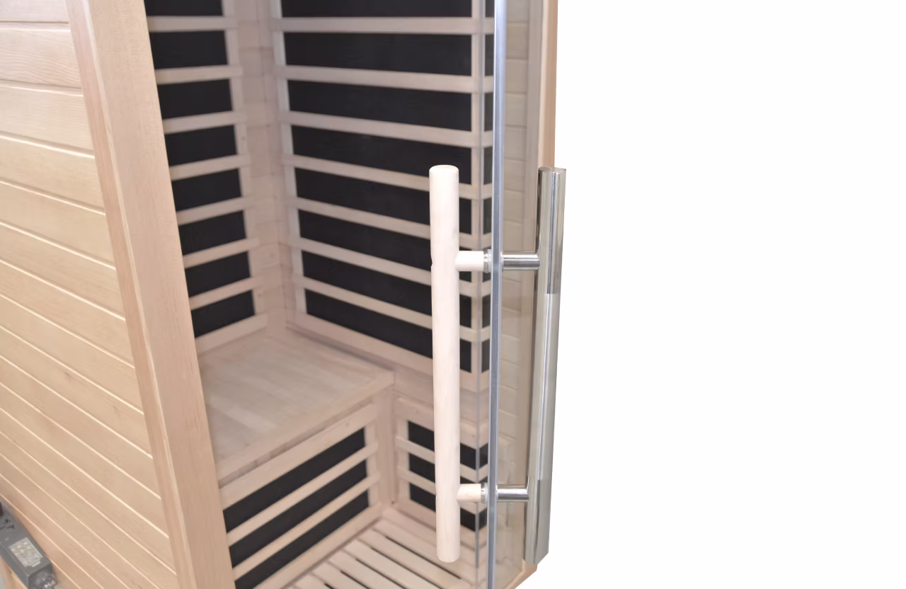 Close-up of a sauna door handle with wooden interior visible.
